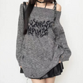 Pull noir oversize en maille motif rouge