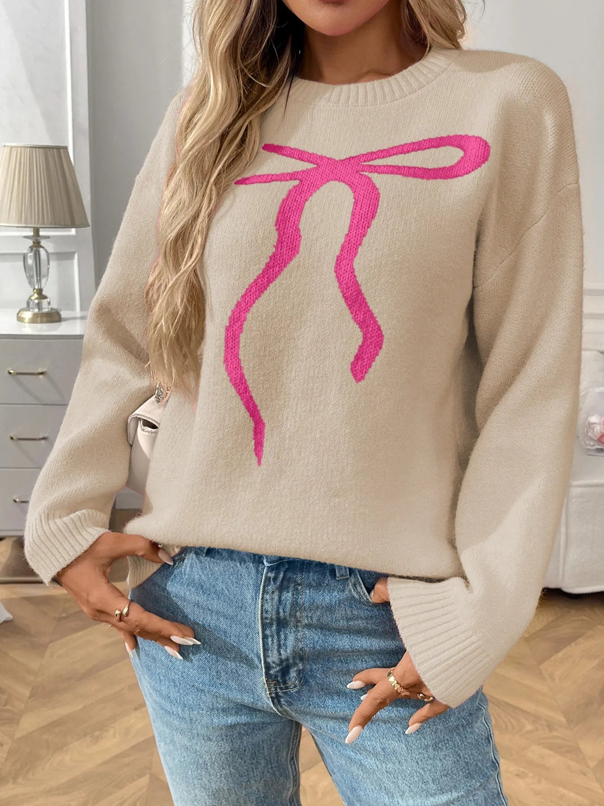 Queniva - Pull élégant col rond avec ourlet côtelé et imprimé nœud